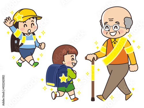 反射板を付けた小学生とシニア男性　交通安全