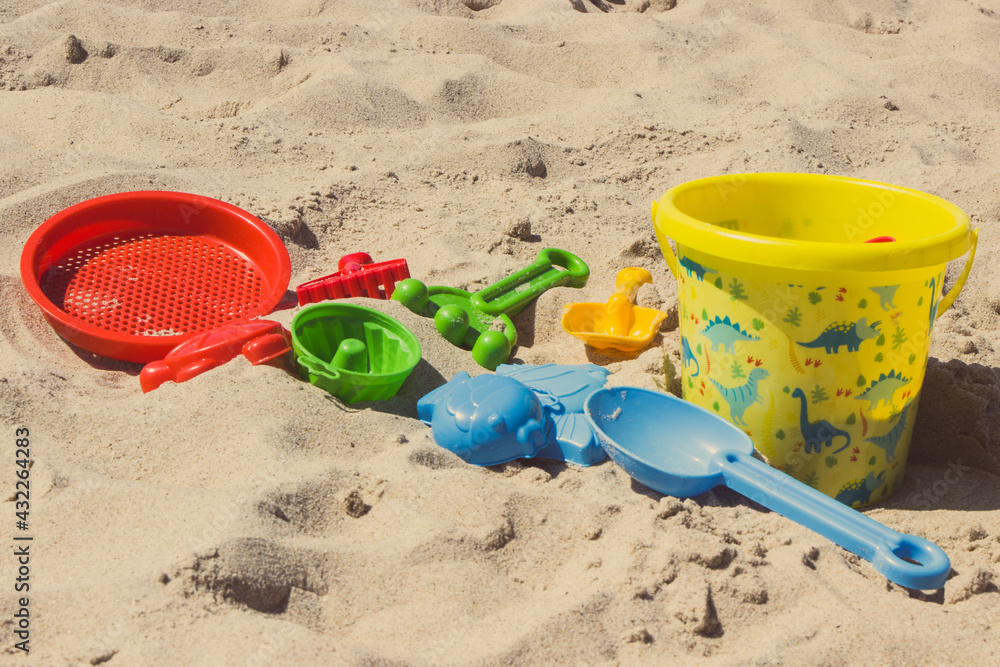 Children toys for relax or playing at beach. Summer, vacation time and child development Children toys for relax or playing at beach. Summer, vacation time and child development