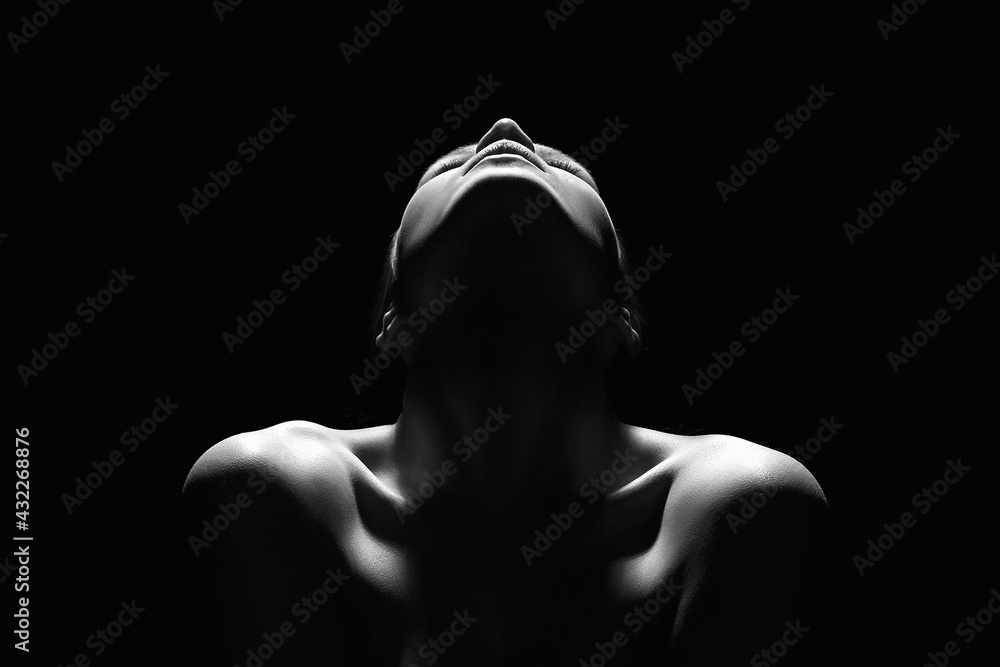 Fototapeta premium Nude Woman silhouette in the dark