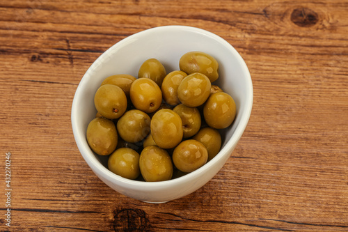 Green pickled olives in the bowl