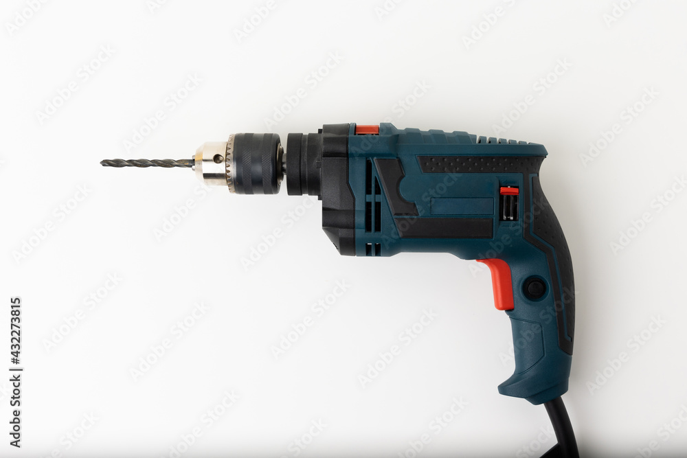 Electric drill on the isolated whited white background.