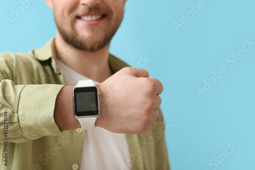 Young man with smart watch ...