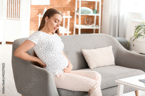 Young pregnant woman suffer...