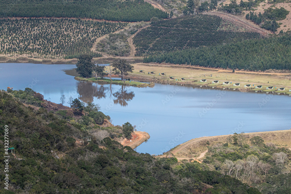 Obraz premium Water Reservoir Surrounded by Natural Rural Vegetation