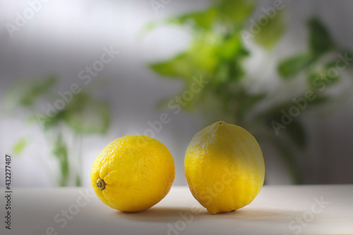 Fresh Lemon or lime a yellow ball on the cooking table., Close-up shot of lemon with blurred background.
