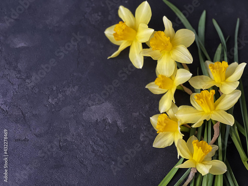 Fototapeta Naklejka Na Ścianę i Meble -  yellow flowers on dark  table