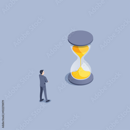 isometric vector illustration on gray background, a man in a business suit looks at the running time in an hourglass