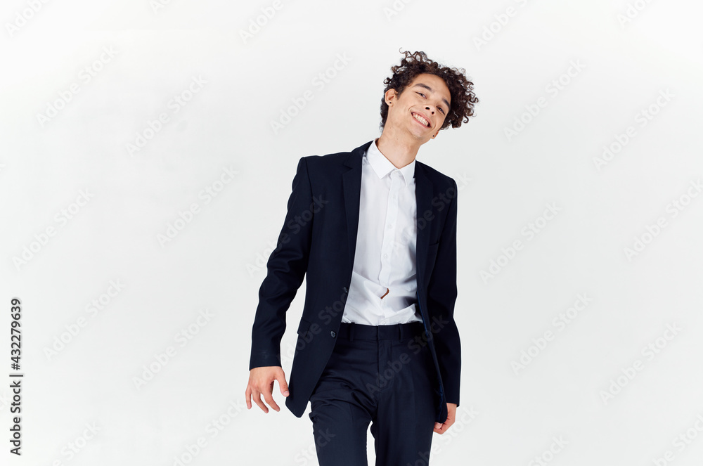 handsome guy with curly hair and in a jacket shirt pants model handsome guy with curly hair and in a jacket shirt pants model