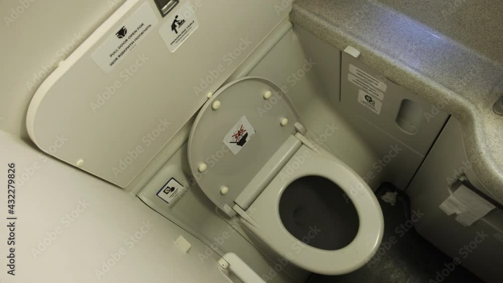Toilet in the plane. Airplane bathroom. Small, compact, public modern