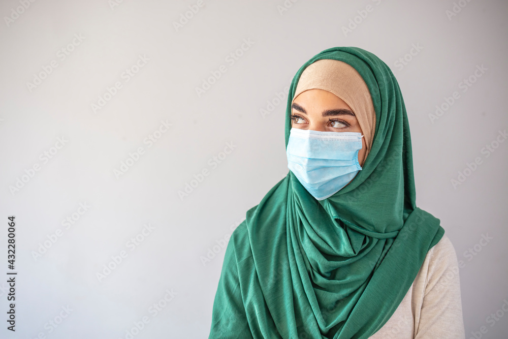 Muslim woman doctor wearing medical mask, muslim girl wearing mask for viral infection. Muslim businesswoman wearing face mask in the office during coronavirus epidemic Muslim woman doctor wearing medical mask, muslim girl wearing mask for viral infection. Muslim businesswoman wearing face mask in the office during coronavirus epidemic