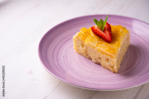 Fototapeta Naklejka Na Ścianę i Meble -  Fruit cake made with apple and pear on a sponge cake.