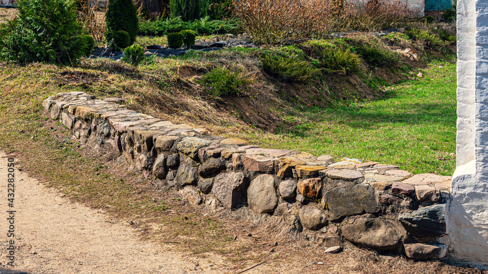 Antique bridge made of stone at the wall of the ancient fortress. Antique bridge made of stone at the wall of the ancient fortress.