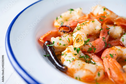 Gambas al ajillo. Shrimp Scampi. Traditional Spanish tapa with prawns cooked in oil with garlic and chilli.