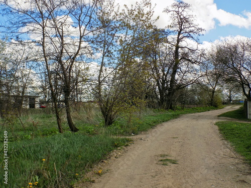 A country road runs past an abandoned garden.
