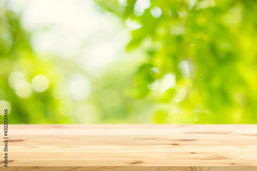 Blur green garden nature background with wooden table space for products advertising montage overlay template. Blur green garden nature background with wooden table space for products advertising montage overlay template.