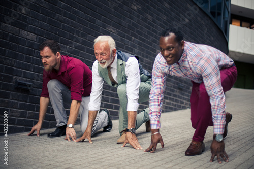 Only one can be a winner. Three business men outside preparing for rice.