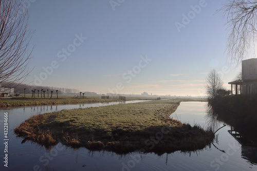 Meadows in the morning sun at Park Hitland in the Netherlands photo