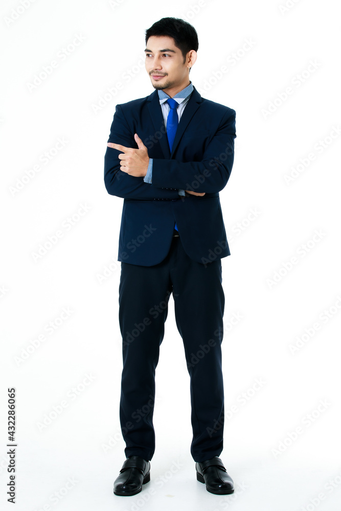 Portrait of cheerful young Asian businessman pointing finger to the side blank space isolated on white background. Studio shot, business and success concept. Portrait of cheerful young Asian businessman pointing finger to the side blank space isolated on white background. Studio shot, business and success concept.
