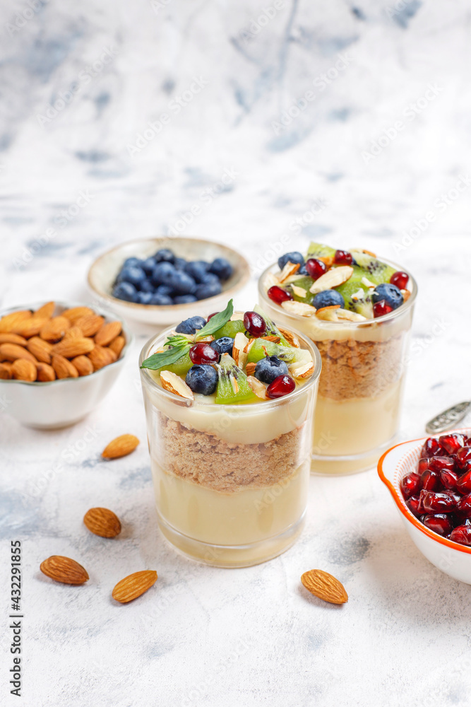 Layered trifle dessert in serving glasses. Layered trifle dessert in serving glasses.