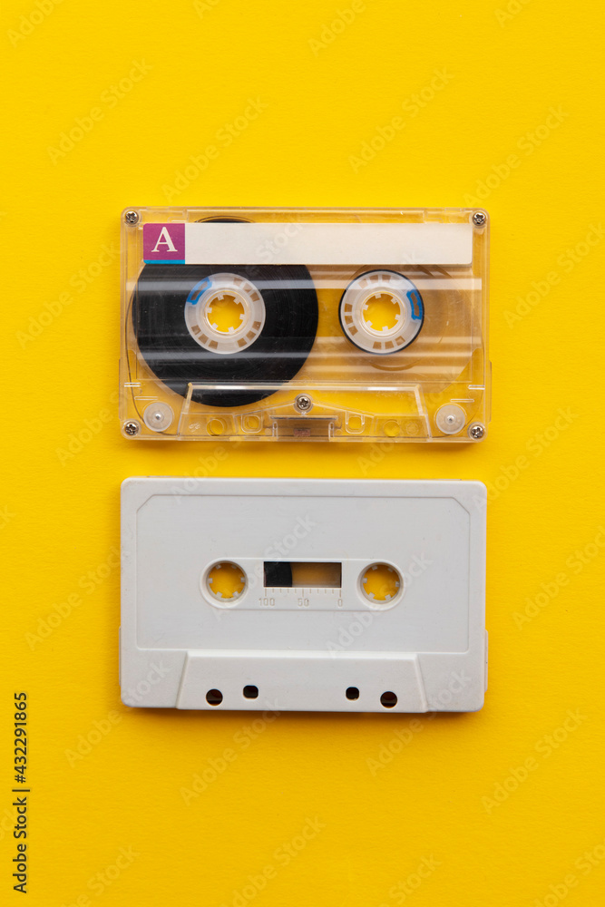 Fototapeta premium vintage white cassette tape on a bright yellow background