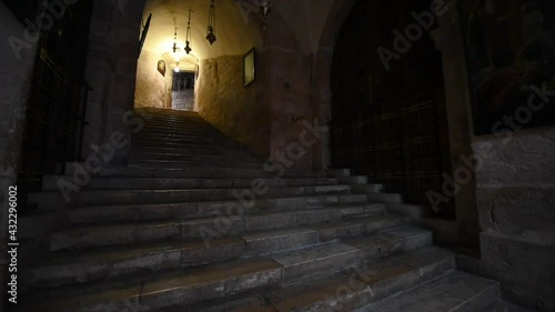 Panning Shot Of Various Paintings On Stone Walls At Church Of The Holy Sepulcher - Jerusalem, Israel