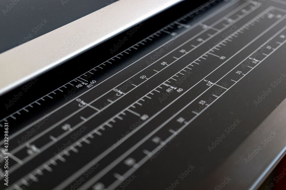 plotter printer, technological tool. Ruler section closeup to measure