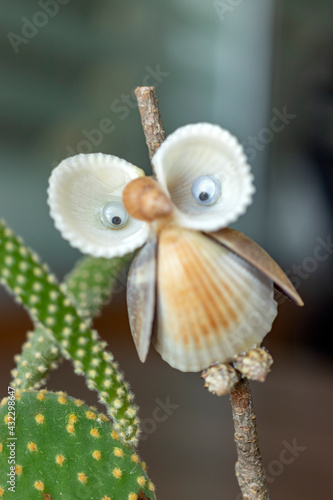 Owl figure made of seashells, cute and close-up.