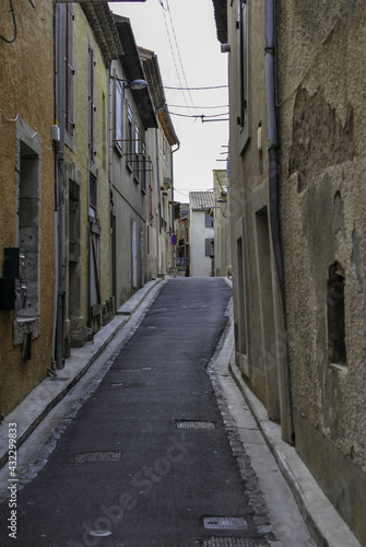 View at the alley between two-story buildings photo