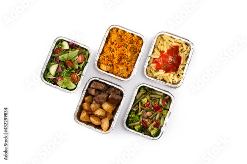 Take away healthy food in foil boxes isolated on white background