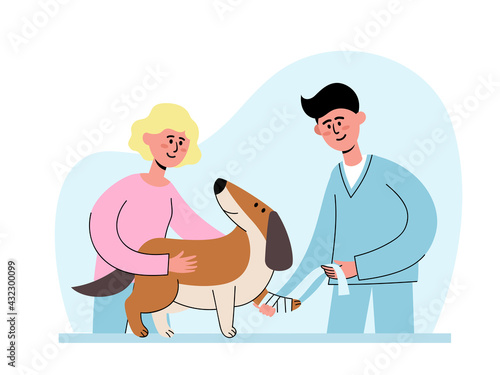 Veterinarian and owner with dog with sore paw at appointment.