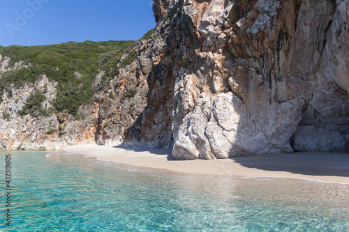 Small picturesque beach surrounded by rocks and clear turquoise water, Albania. Travel theme, beautiful nature
