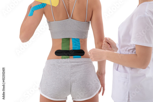 Canvas-taulu dynamic functional bandage with kinesio taping on the female back