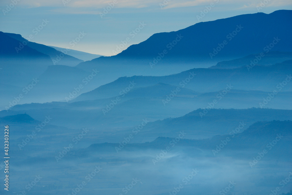 Blue hour mountains of the Sierra Monsec in the evening haze