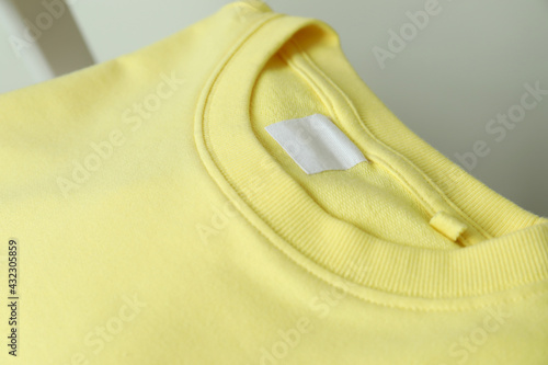 Blank yellow sweatshirt, close up and space for text