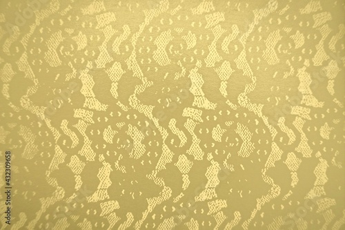 Gold lace pattern and tulle (yellow pastel) design. Elegant mesh pattern, lacey floral texture with copy space, and backdrop template.  Design element for paper, invitation, packaging, etc.