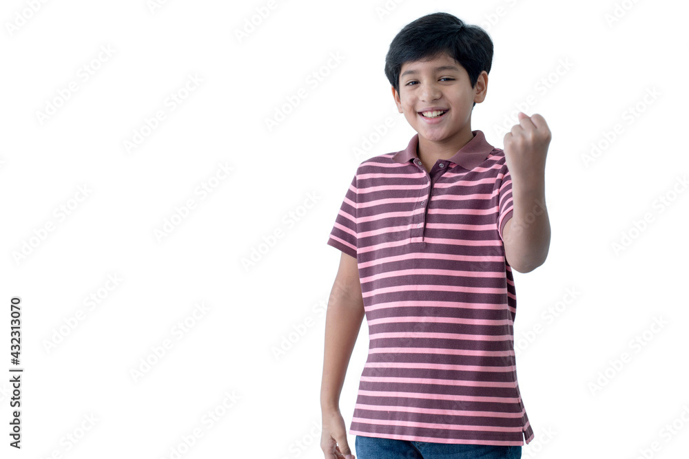 Portrait of a happy Indian boy over white background, make a fist gesture to celebrate success, with clipping path