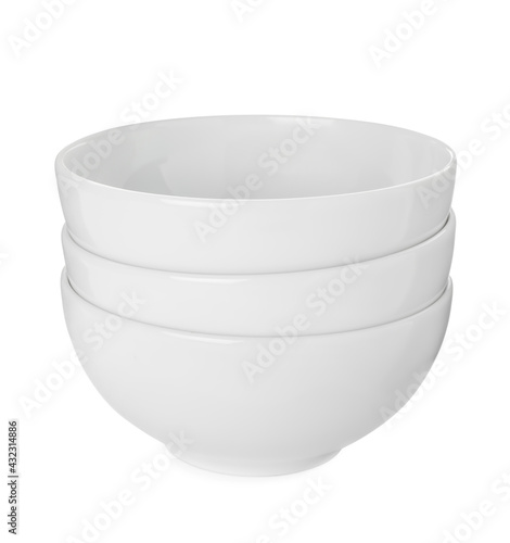 Stack of clean ceramic bowls isolated on white