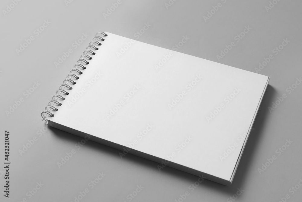 Blank notebook on light grey background. Mockup for design Blank notebook on light grey background. Mockup for design