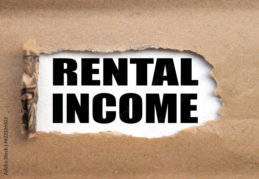 Obraz premium Rental income. Torn paper paper background. Abstract background. Stock image.
