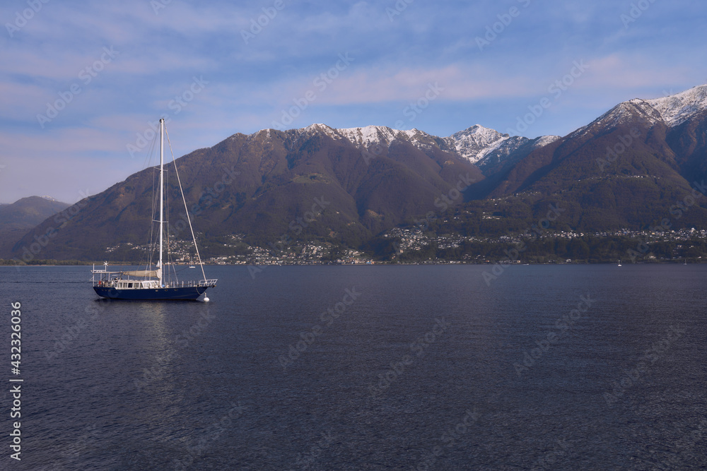 Boat on the lake with mountains view in Switzerland Boat on the lake with mountains view in Switzerland