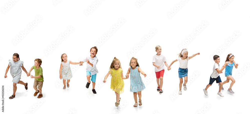 Group of happy school kids or pupils running in colorful casual clothes on white studio background. Creative collage.