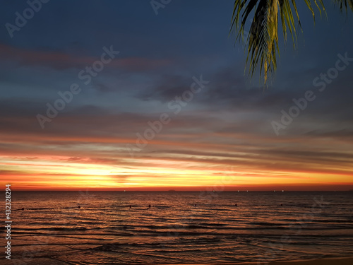 Beautiful sunset on the background of a tropical sea beach