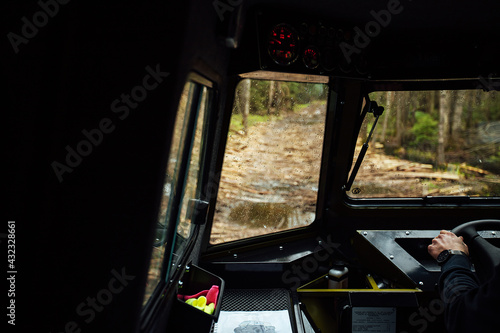 Fototapeta Naklejka Na Ścianę i Meble -  the driver is driving off-road. view from the interior of a four-wheel-drive car on a dirt road. dangerous passage of the trophy raid. extreme driving