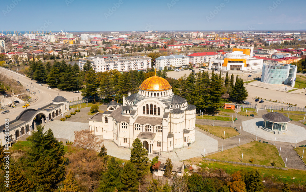 Obraz premium View from drone of modern landscape of Georgian port city of Poti overlooking residential areas and Orthodox Cathedral in Neo-Byzantine style on sunny spring day, Samegrelo-Zemo Svaneti region