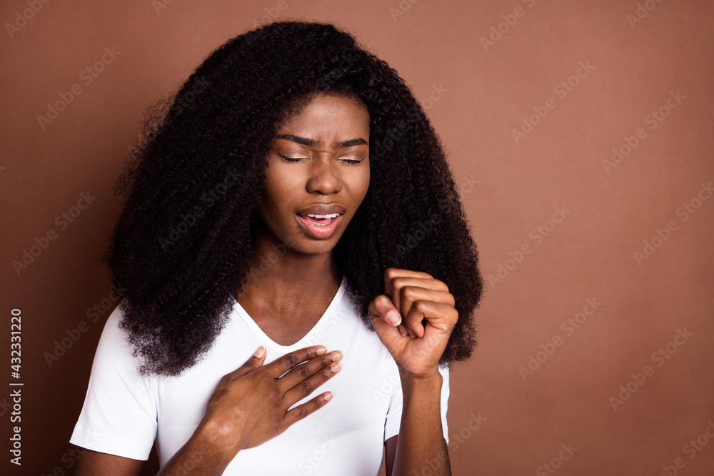 Portrait of young dark skin lady closed eyes arm on chest cough feel ...