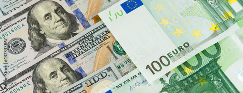 Dollar euro banner background banknotes of hundred bills. American US and European EU cash