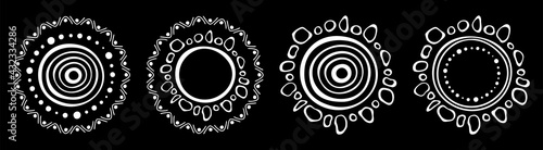 Set of stylized suns. Australian art. Aboriginal painting style. Smooth round white shapes, circles isolated on black background. Doodle sketch style. Vector monochrome illustration.
