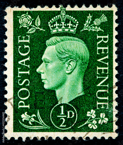 Postage stamp printed in the United Kingdom with a portrait of king George the Sixth photo