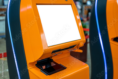 mockup airport self check-in device with blank white screen. Self service machine and help desk kiosk at airport for check in, printing boarding pass or buying ticket. copy space
