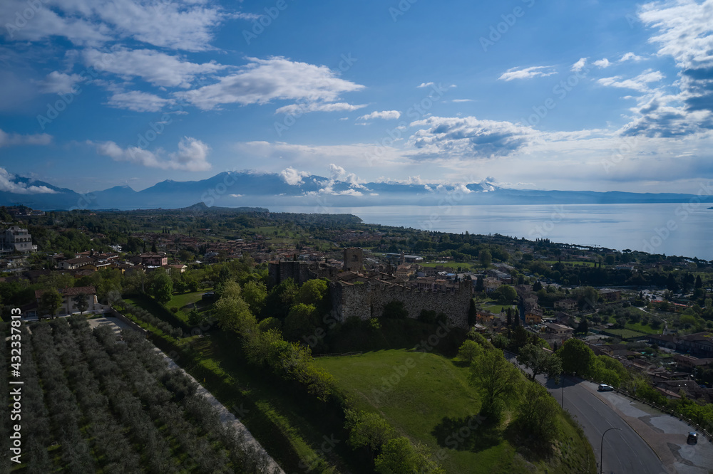 Aerial view of the historic part of Padenghe Castle on Lake Garda, Italy. Panorama of Lake Garda. Historic castles in Italy. Top view of the castle.